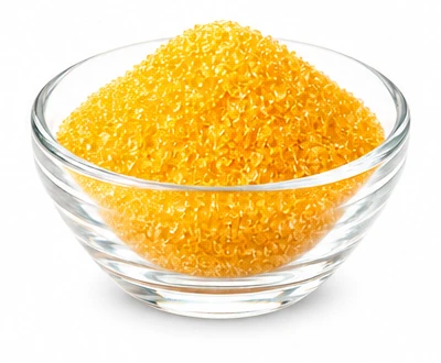 Glass bowl of mango gold sugar crystals